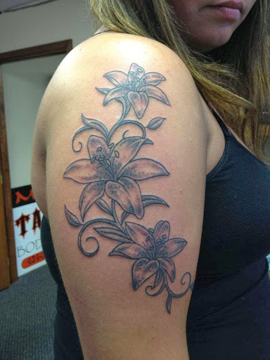 Explore half sleeve tribal tattoo ideas, creative tattoo ideas in Charlottesville, available at Mystic Tattoo and Body Piercing