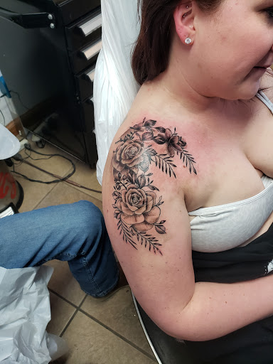 Explore lion sleeve tattoo ideas, creative tattoo ideas in Elko, available at Tom Custom Tattoos and Body Piercing Studio