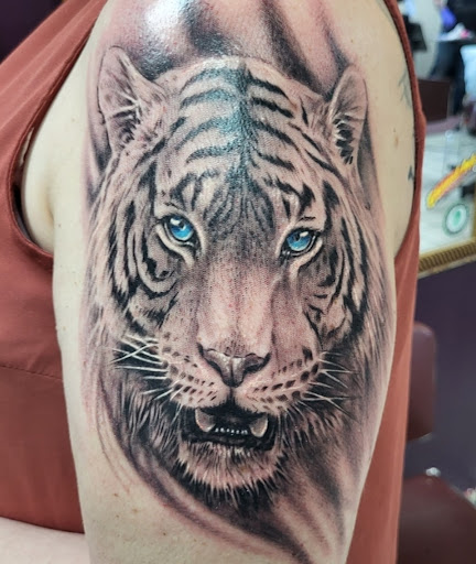 Find unique family tattoo ideas for your next unique tattoo in Grand Ledge at Van Gogh Tattoos