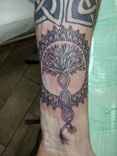 Explore dainty spine tattoo ideas, creative tattoo ideas in Buford, available at Wild Tribe Tattoos and Piercings