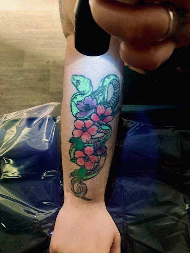 Explore paw tattoo ideas, creative tattoo ideas in Lake City, available at Crooked Spines Tattoo Studio