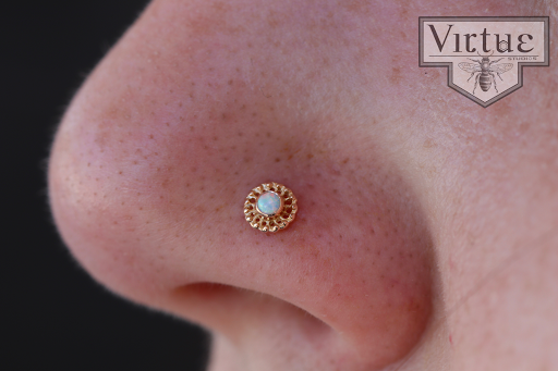 Explore tramp stamp cover up tattoo ideas, creative tattoo ideas in Ormond Beach, available at Virtue Studios