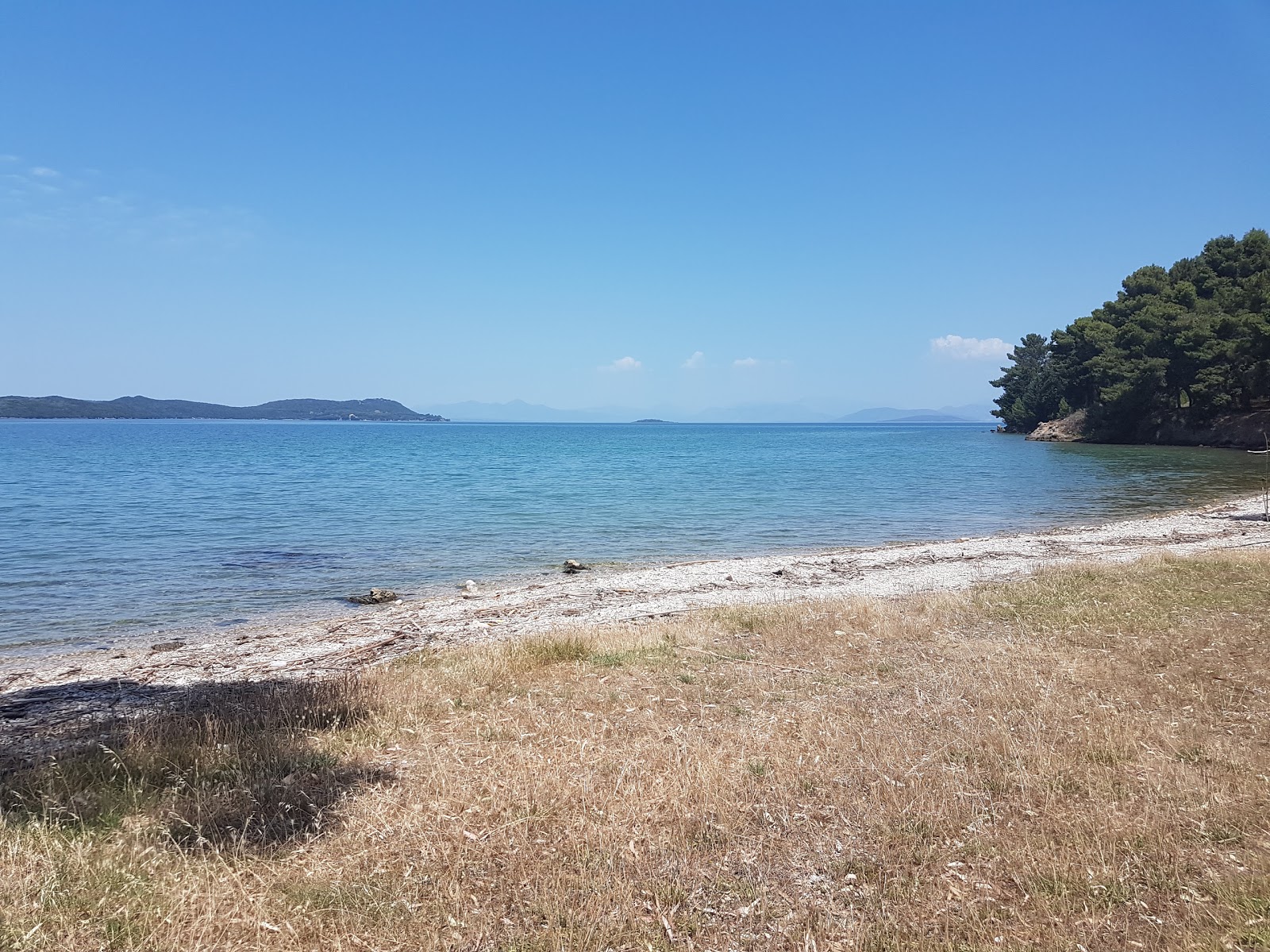 Foto de Porticciolo small beach con playa recta