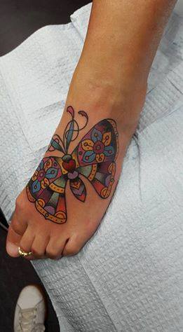 Explore female tattoo ideas for lower back, creative tattoo ideas in Cincinnati, available at Tattoo Makers