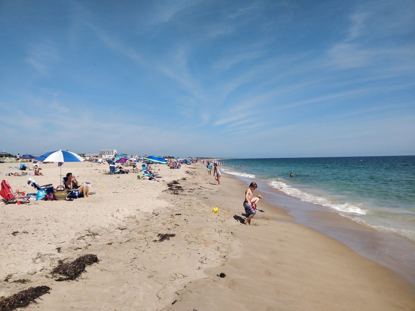 Foto av Blue Shutters Beach med lång rak strand