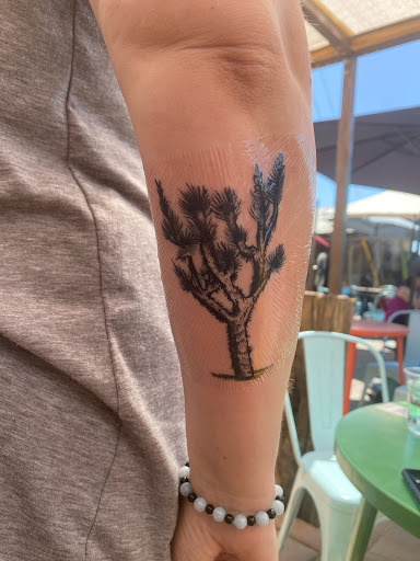 Explore wrist wrap tattoo ideas, creative tattoo ideas in Yucca Valley, available at Strata Tattoo Lab LLC