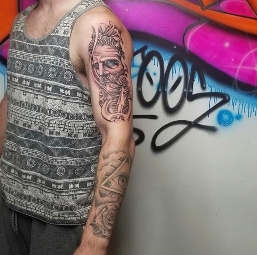 Explore flower arm sleeve tattoo ideas, creative tattoo ideas in Keyport, available at Taboo Tattoos