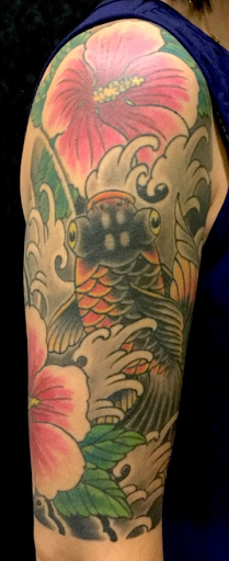 Explore dog tattoo ideas for guys, creative tattoo ideas in Green Bay, available at Katana Tattoo