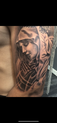 Explore kiss tattoo ideas, creative tattoo ideas in Patchogue, available at Royalty Ink Body Art & Gallery