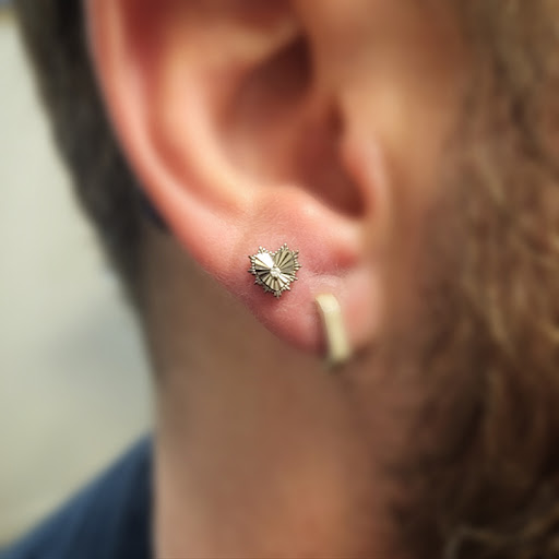 Explore december birth flower tattoo ideas, creative tattoo ideas in Tempe, available at Club Tattoo