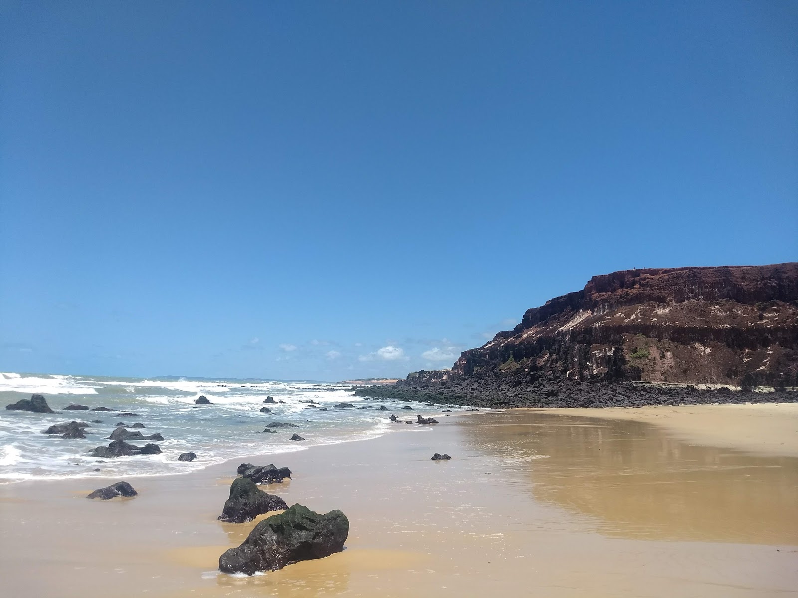 Foto de Praia das Minas e o assentamento
