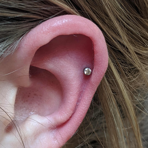 Explore barber pole tattoo ideas, creative tattoo ideas in Coeur D Alene, available at Relic Moon Fine Jewelry & Body Piercing