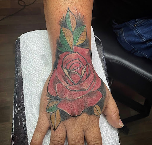 Explore reading tattoo ideas, creative tattoo ideas in Fort Myers, available at Loyal 2 The Coil Tattoos & Piercings (Edison Mall Location Entrance F)