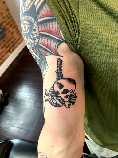 Explore wisdom tattoo ideas, creative tattoo ideas in Kansas City, available at Golden Stag Tattoo and Gallery