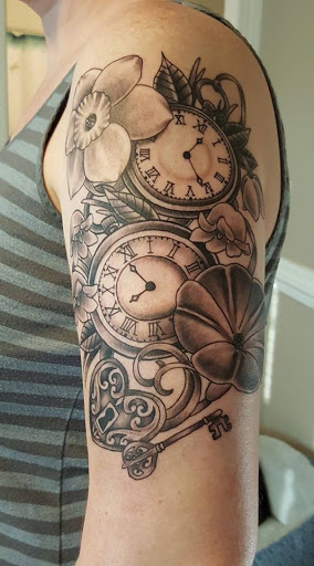 Explore tattoo ideas for female thigh, creative tattoo ideas in Clayton, available at Shades of Gray