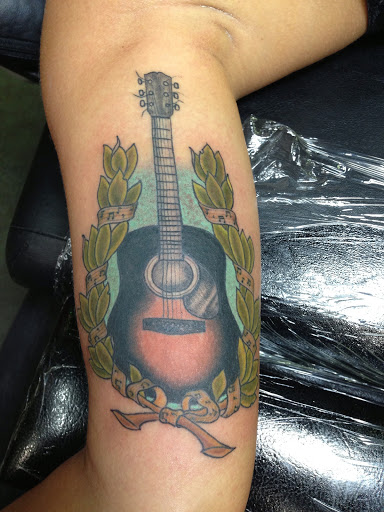 Explore black king tattoo ideas, creative tattoo ideas in Reno, available at Aces Tattoo