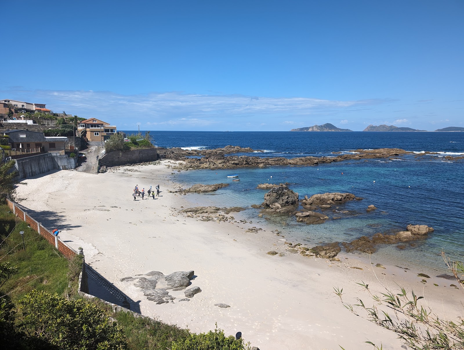 Foto di Praia do Portino con una superficie del sabbia beige