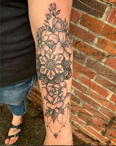 Explore small thigh tattoo ideas, creative tattoo ideas in Omaha, available at Collective Hive Tattoo