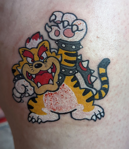 Explore memorial dog tattoo ideas, creative tattoo ideas in Washington, available at Rockstar Tattoo and Piercing Studio LLC