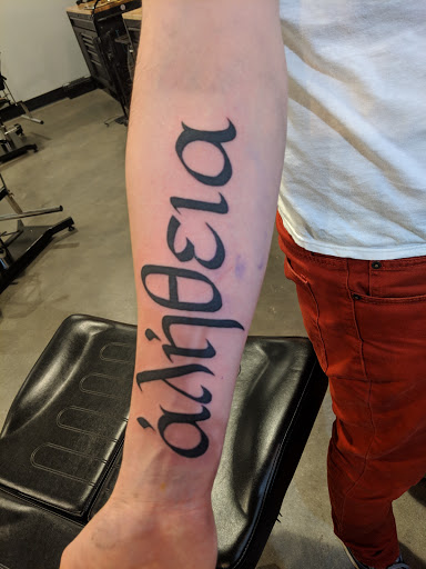 Explore strength tattoo ideas, creative tattoo ideas in Minneapolis, available at Timeless Tattoo