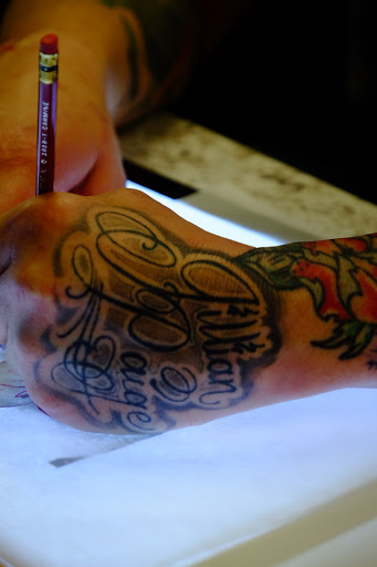 Explore apple tattoo ideas, creative tattoo ideas in Columbia, available at Brightmoor Tattoo