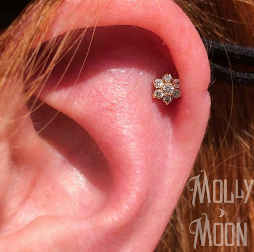 Explore ideas for elbow tattoos, creative tattoo ideas in Oshkosh, available at Piercings by Molly Moon at 920 Tattoo and Piercing