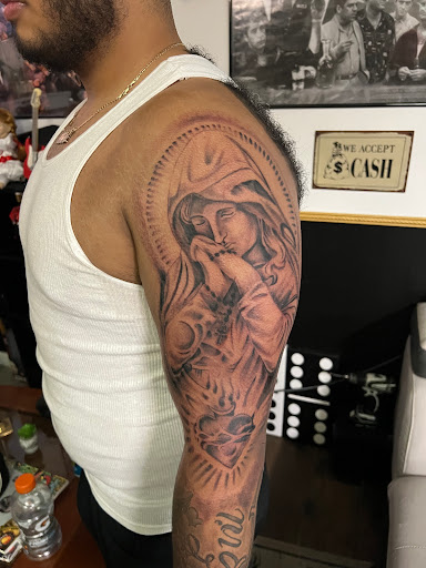 Explore pistol tattoo ideas, creative tattoo ideas in Lakeville, available at Savage Ink
