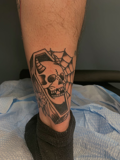 Explore lung cancer ribbon tattoo ideas, creative tattoo ideas in Merrick, available at Wyld Chyld Tattoo