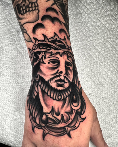 Explore wrap tattoo ideas, creative tattoo ideas in Johnson City, available at Gold Cross Tattoo Co.