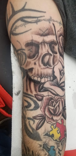Explore tribal dragon tattoo ideas, creative tattoo ideas in Lewiston, available at Walkins tattoos studio