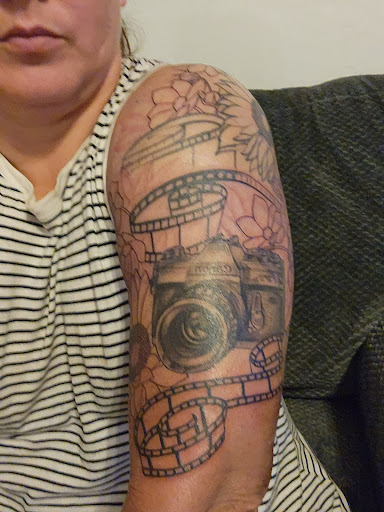 Explore cover up tattoo ideas male chest, creative tattoo ideas in Peoria, available at Iron Key Tattoo Studio Inc.