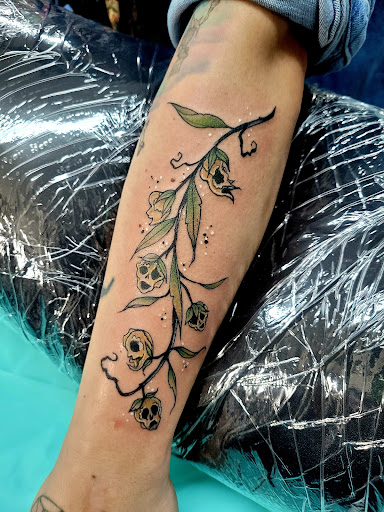 Explore small dinosaur tattoo ideas, creative tattoo ideas in Benton, available at Spectrum Tattoo