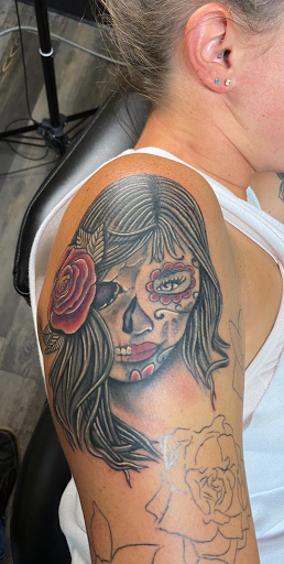 Explore large flower tattoo ideas, creative tattoo ideas in Warner Robins, available at Untold Pain Tattoo Studio