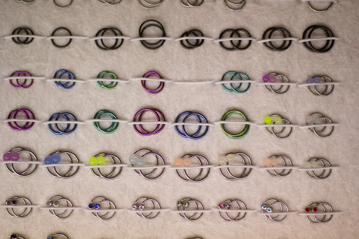 Explore shark tooth tattoo ideas, creative tattoo ideas in Kansas City, available at Working Class Tattoo