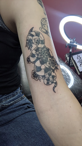 Explore survivor tattoo ideas, creative tattoo ideas in Providence, available at F.I.N.A.O. Ink Tattoo Company