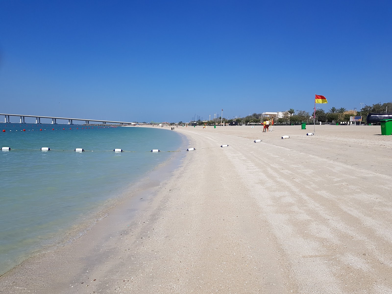 Photo of Al Bateen beach with white fine sand surface