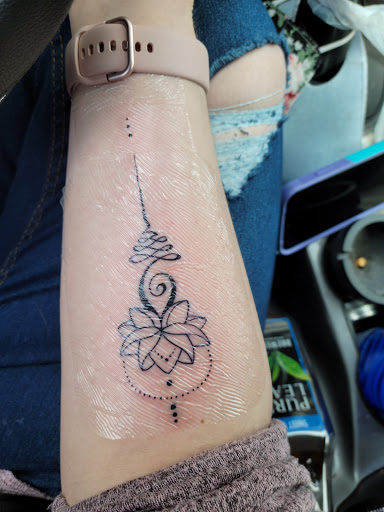 Explore green ranger tattoo ideas, creative tattoo ideas in Canton, available at Couture Tattoo and Body Piercing