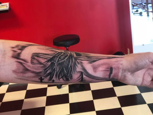 Explore cool guitar tattoo ideas, creative tattoo ideas in Dunn, available at Yankee Tattoo and Piercing