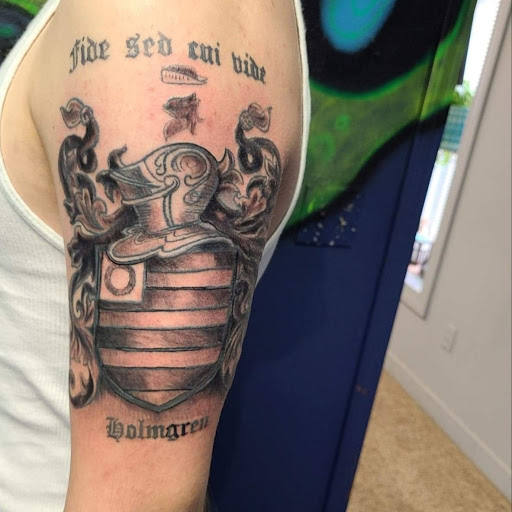 Explore men's back of neck tattoo ideas, creative tattoo ideas in Pittsburg, available at NeonMoon Tattoo