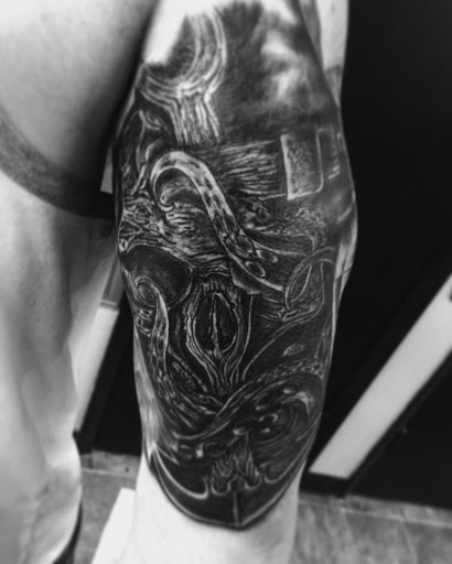 Explore cool cross tattoo ideas, creative tattoo ideas in Santa Rosa, available at Eternal Art Tattoo Gallery