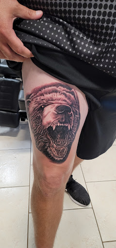 Explore roses tattoo ideas, creative tattoo ideas in Ocoee, available at Slaughterized Ink Tattoo and Piercing Studio