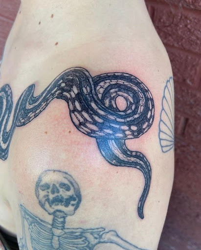 Explore back tattoo ideas for men, creative tattoo ideas in Boulder, available at Claw and Talon Tattoo