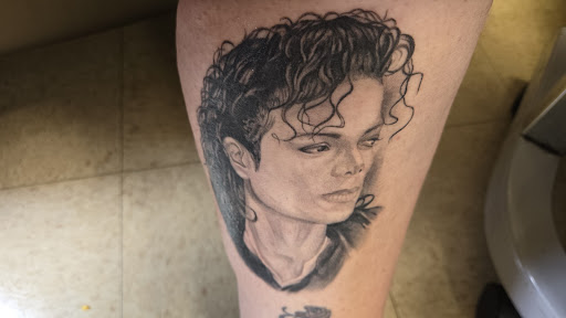 Explore rockstar tattoo ideas, creative tattoo ideas in Jamestown, available at Wildside Tattoo & Piercing