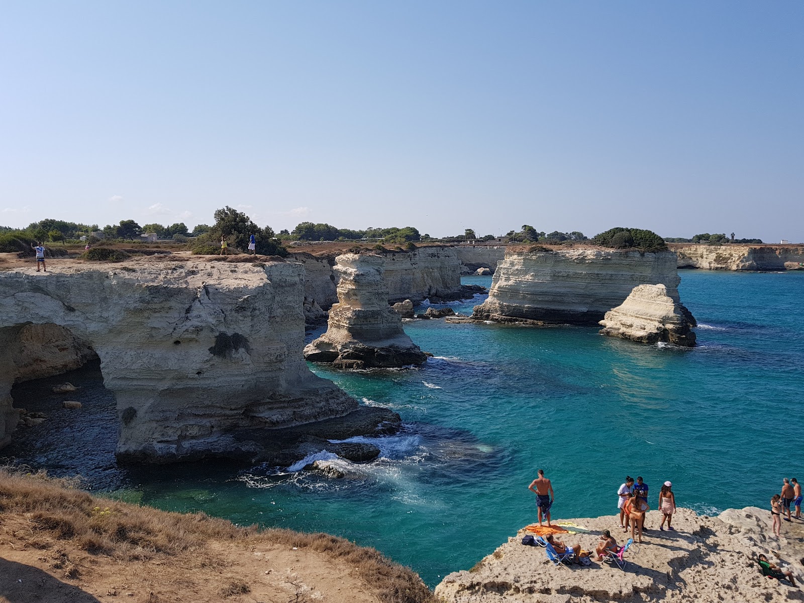 Spiaggia Torre Sant'Andrea'in fotoğrafı küçük koy ile birlikte