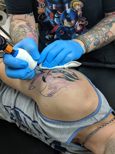 Explore cover up tattoo ideas for chest, creative tattoo ideas in Springfield, available at Area 51 Tattoo