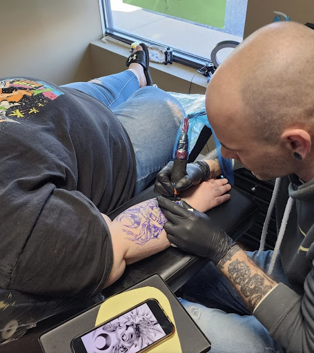 Explore hood tattoo ideas, creative tattoo ideas in Wisconsin Dells, available at Twisted Dimensions Tattoo Studio