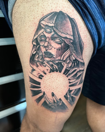 Explore cover up flower tattoo ideas, creative tattoo ideas in Orange, available at Top Floor Tattoo Studio