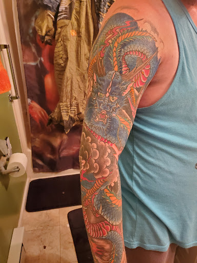 Explore leo sleeve tattoo ideas, creative tattoo ideas in Delmar, available at Obbey Tattooing