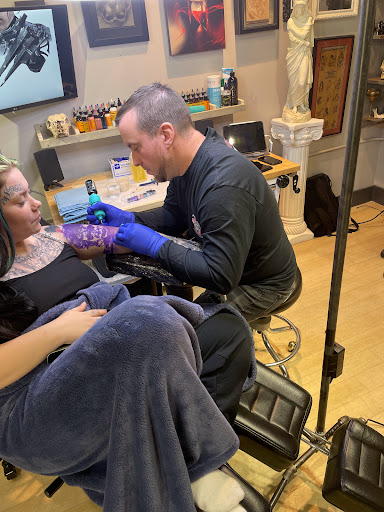 Explore weightlifting tattoo ideas, creative tattoo ideas in Fort Wayne, available at Grade A Tattoos and Body Piercing