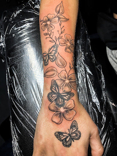 Explore purple rose tattoo ideas, creative tattoo ideas in Bowling Green, available at Ink Therapy and Body Piercing